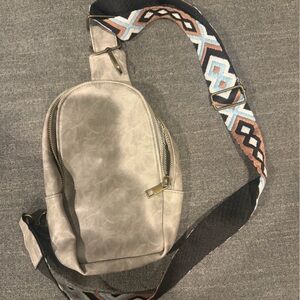Stylish Beige Crossbody Bag with Patterned Strap